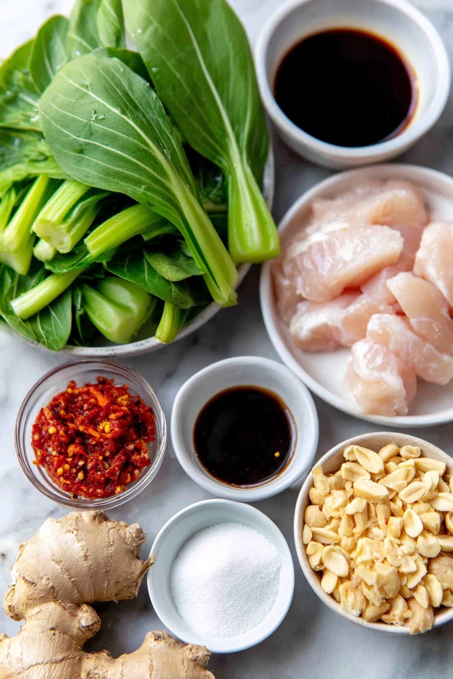 Flat lay of a fresh 1-inch knob of peeled ginger root, six whole garlic bulbs with white papery skin, a small handful of vibrant fresh Thai basil leaves, a medium shiny red onion halved to show its bright purple interior, a handful of crisp baby bok choy leaves roughly chopped, thin sliced raw boneless chicken breast strips neatly arranged, a small white ceramic bowl of glossy dark reduced sodium soy sauce, a small white ceramic bowl with clear pale rice vinegar, a small white ceramic bowl filled with golden toasted sesame oil, a small white ceramic bowl holding pale granulated sugar, a small white ceramic bowl containing white cornstarch powder, a small white ceramic bowl with deep red chili paste, a small white ceramic bowl of crushed dry-roasted peanuts, and a mound of fluffy white coconut jasmine rice arranged perfectly—placed on a clean white marble surface, soft natural light, photo taken with an iPhone, professional food photography style, fresh ingredients, white ceramic bowls, no bottles, no duplicates, no utensils, no packaging --ar 2:3 --v 7 --p m7354615311229779997