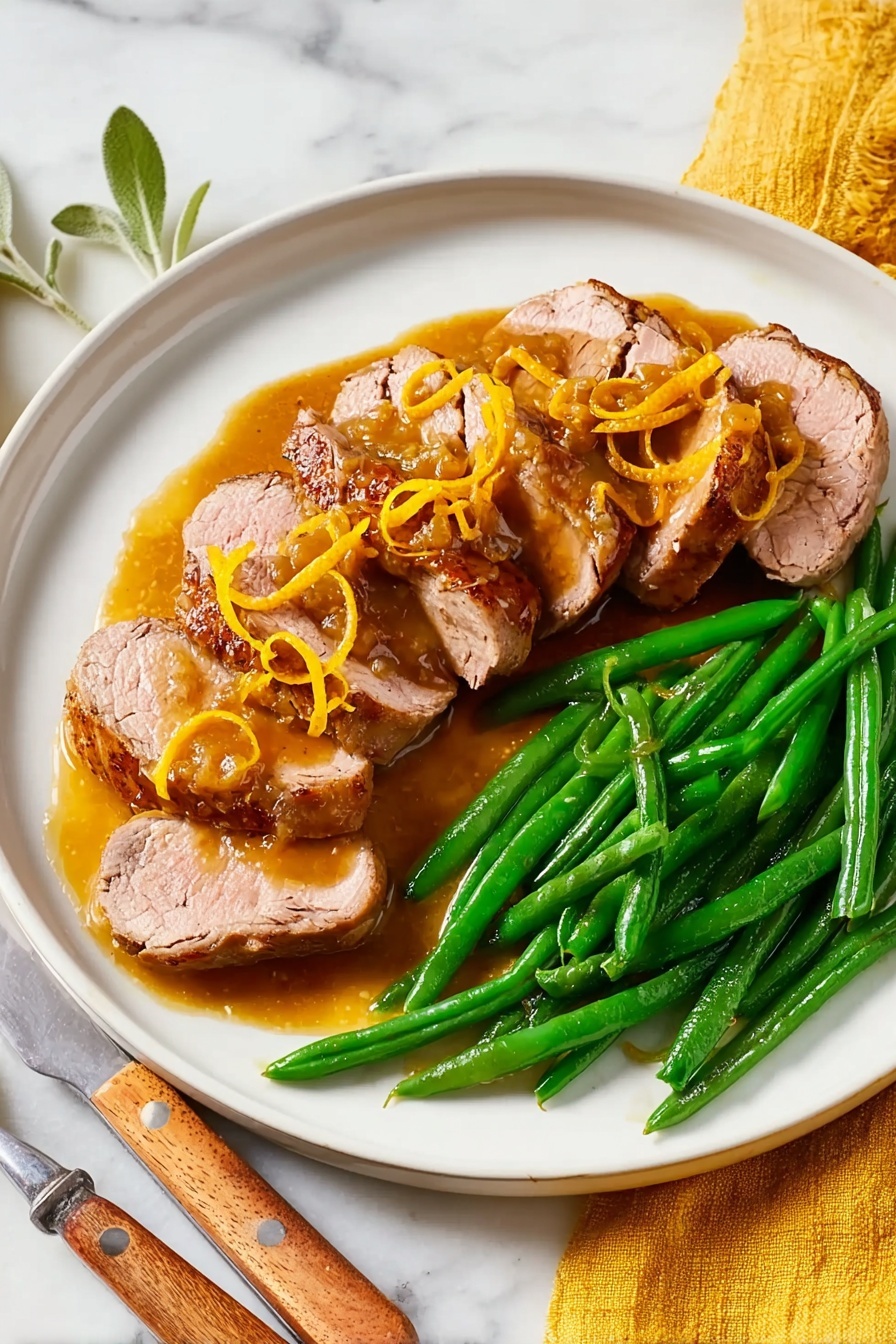 A white plate holds six thick slices of cooked meat arranged in a half-circle along the bottom and left side. The meat is light pink inside with a browned outer layer and is topped with a brown sauce and thin strips of orange zest. On the top right side of the plate, there is a neat pile of shiny, bright green cooked green beans. The plate sits on a white marbled surface with a yellow cloth napkin near the bottom left, and a fork with a wooden handle is partly visible on the right side. Photo taken with an iphone --ar 2:3 --v 7