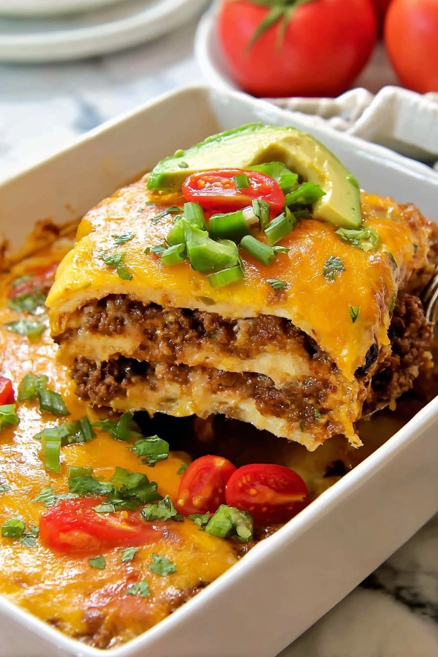 The image shows a tall slice of layered lasagna lifted from a white baking dish, revealing several alternating layers of melted cheese, seasoned meat mixed with black olives, and pasta sheets. The top layer is covered with golden melted cheese and colorful garnishes including sliced green bell peppers, chopped cilantro, red cherry tomato halves, and a small pile of sliced avocado. Around the lifted slice, there are more cherry tomato halves and diced green bell peppers on the side within the white dish. The background has a soft focus on a white marbled surface. Photo taken with an iphone --ar 2:3 --v 7
